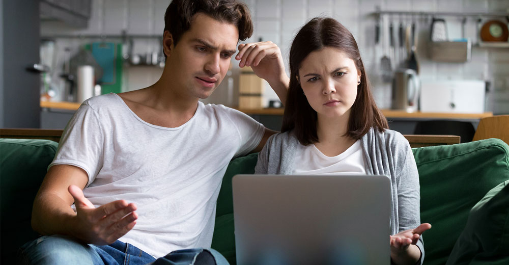 millennial couple using the internet